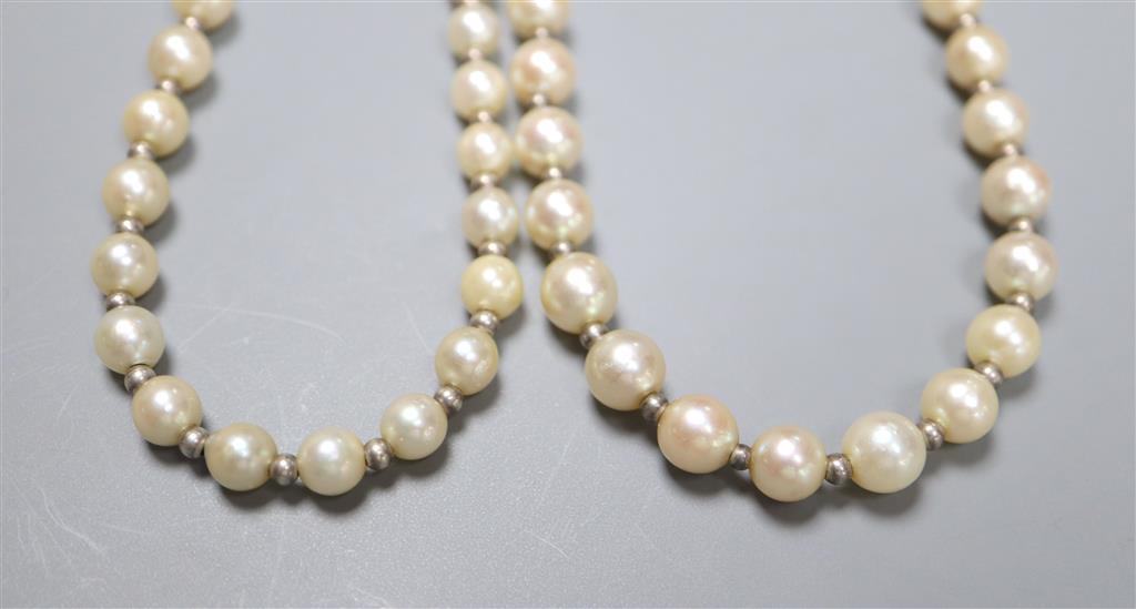 Two similar French silver strand cultured pearl necklaces with diamond set white metal( French 18ct poincon mark) clasps,